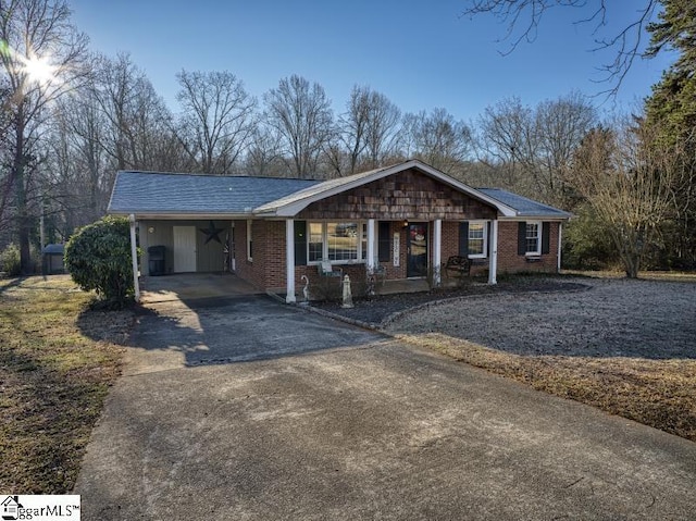 ranch-style house with a carport and a porch