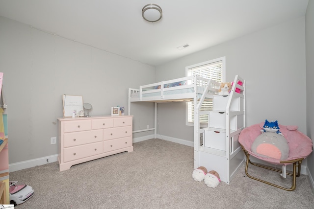 bedroom featuring light colored carpet