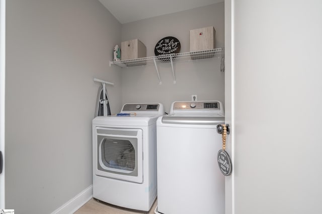 clothes washing area featuring washing machine and clothes dryer