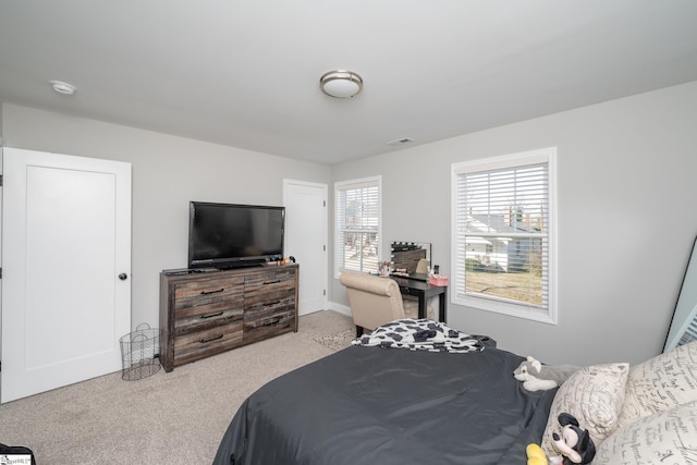 bedroom with light carpet