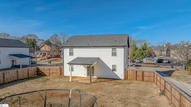 rear view of house with a lawn