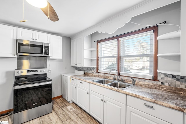 kitchen with ceiling fan, sink, white cabinets, and appliances with stainless steel finishes