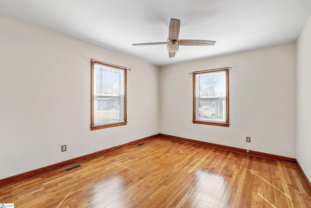 unfurnished room with ceiling fan and wood-type flooring