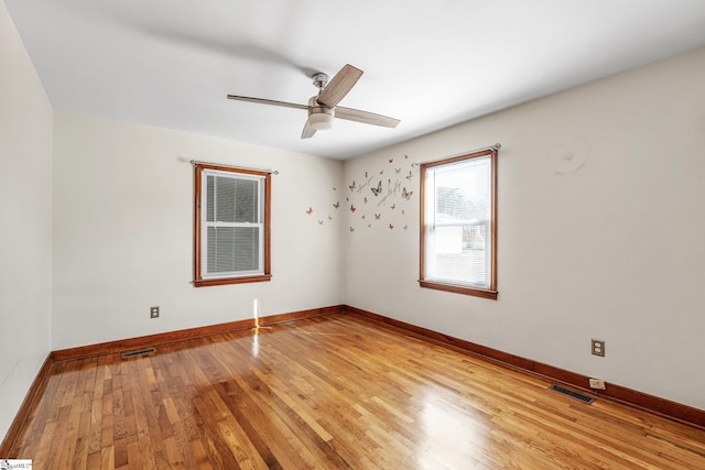 spare room featuring ceiling fan and light hardwood / wood-style floors