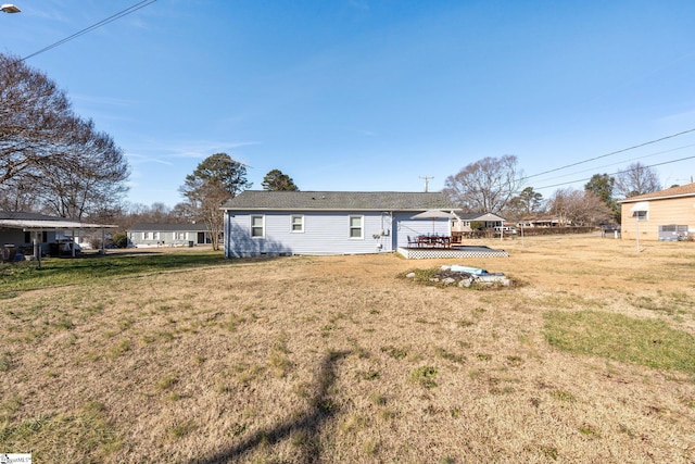 back of property with a lawn, a gazebo, and a deck