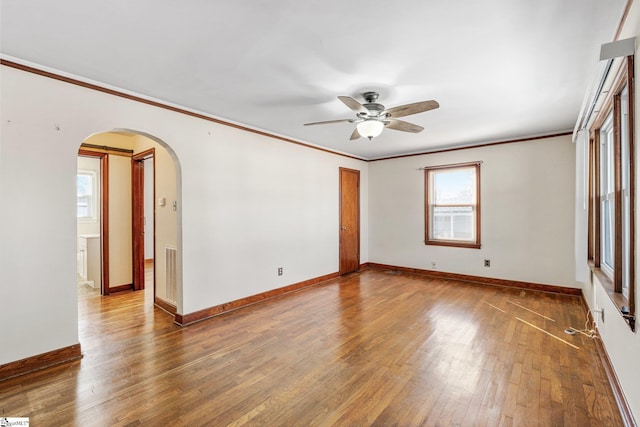 spare room featuring ceiling fan, ornamental molding, and hardwood / wood-style floors