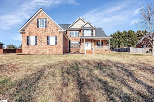 view of front of home featuring covered porch and a front yard