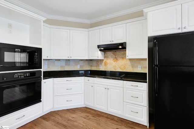 kitchen featuring backsplash, white cabinets, black appliances, and ornamental molding