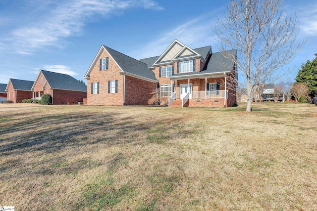 view of front facade featuring a front lawn and a porch