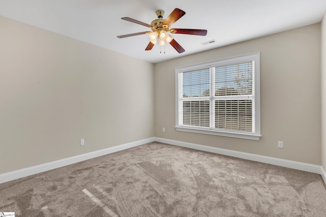 carpeted empty room with ceiling fan