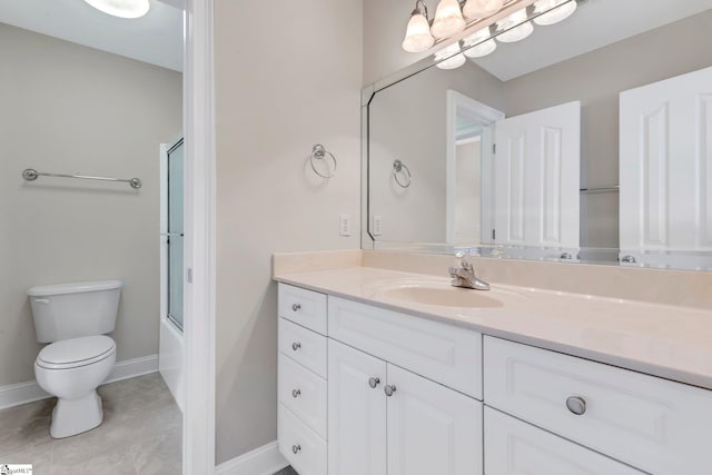 full bathroom featuring shower / bath combination with glass door, vanity, and toilet