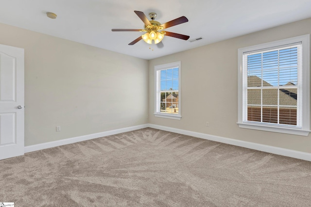 carpeted empty room with ceiling fan