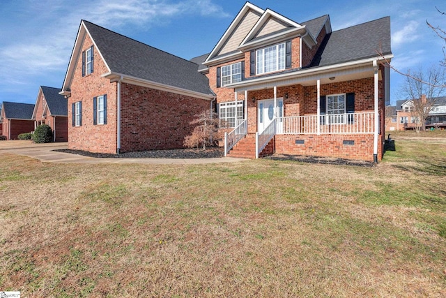 view of front of home with covered porch and a front lawn