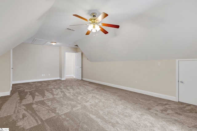 additional living space with ceiling fan, vaulted ceiling, and carpet flooring