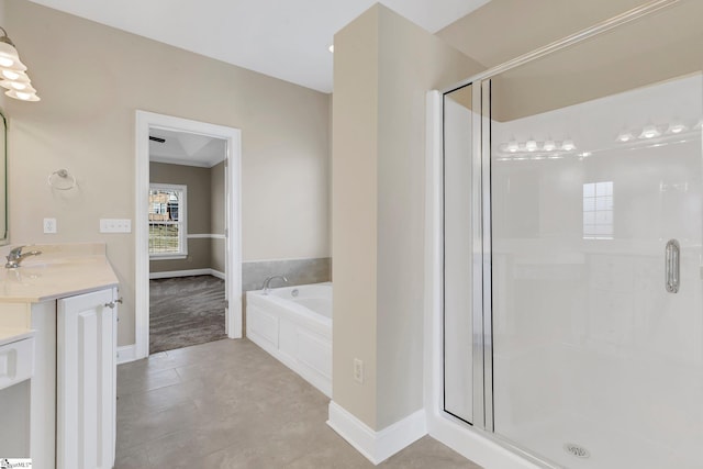 bathroom with tile patterned floors, vanity, ornamental molding, and shower with separate bathtub