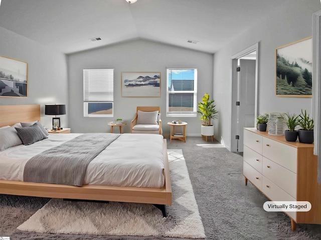 bedroom featuring vaulted ceiling and carpet