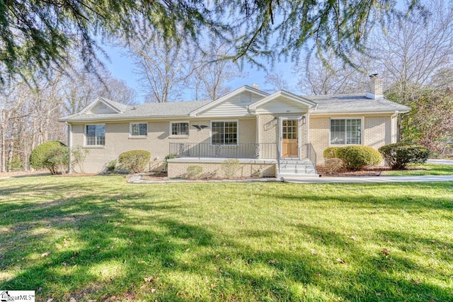 ranch-style house with a front lawn