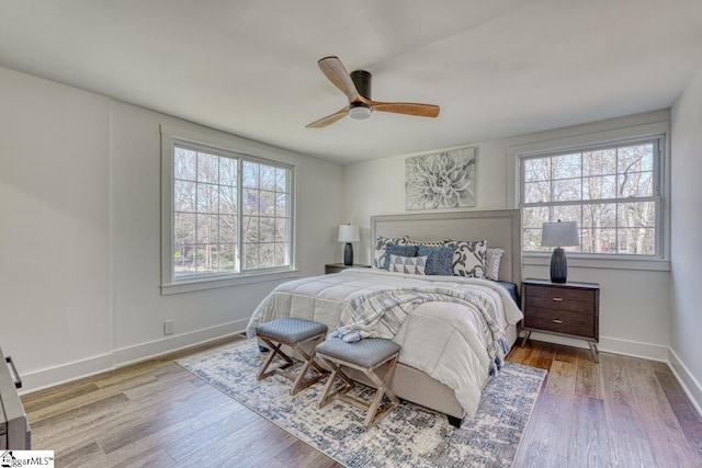 bedroom with ceiling fan and hardwood / wood-style floors