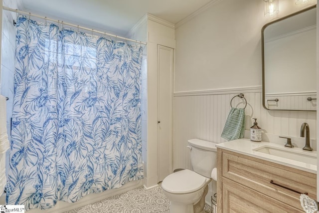 bathroom featuring toilet, tile patterned flooring, ornamental molding, vanity, and curtained shower