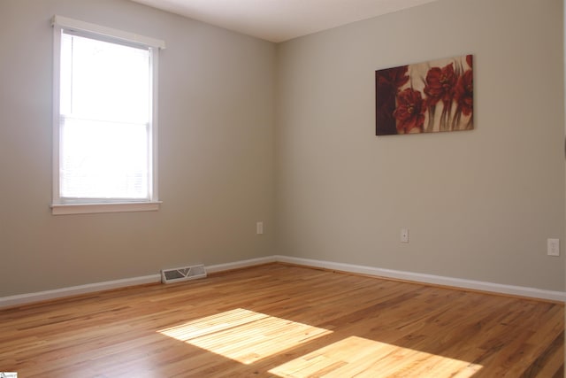 unfurnished room featuring light hardwood / wood-style floors