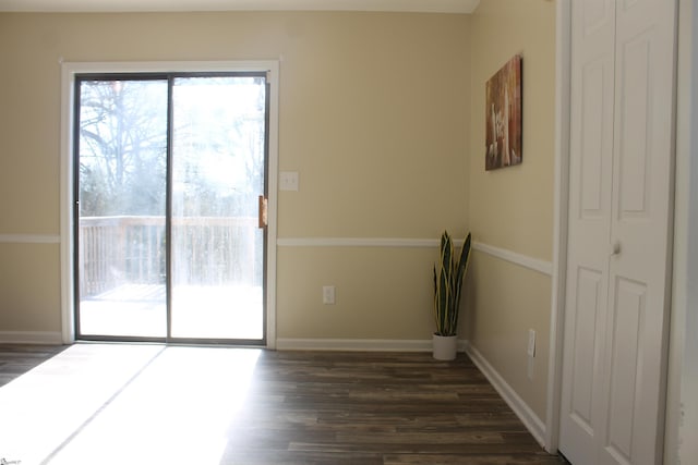 spare room featuring dark hardwood / wood-style floors