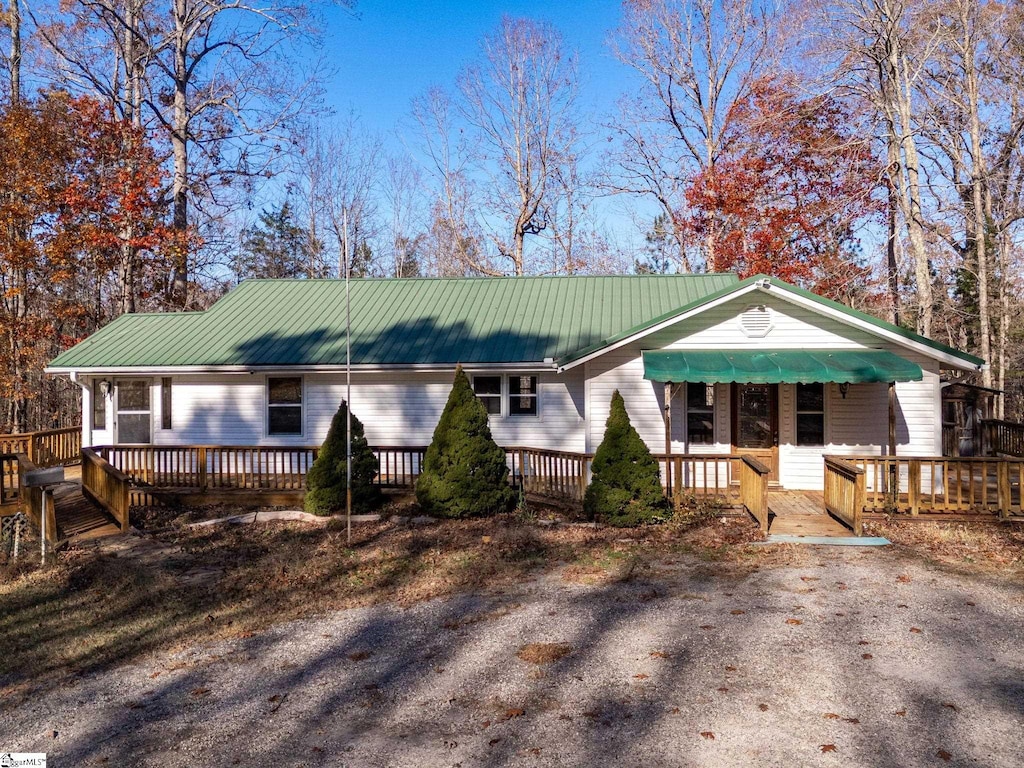 view of front of home featuring a wooden deck