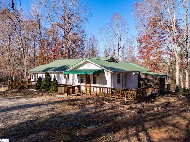 view of front of property with a wooden deck