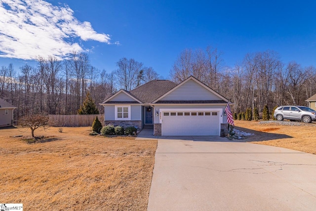 view of front of home featuring a front lawn and a garage