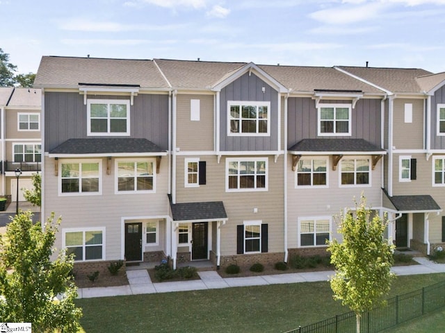 view of property featuring a front yard