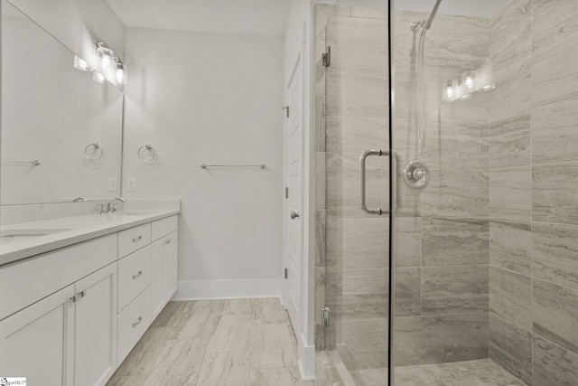 bathroom with vanity and an enclosed shower