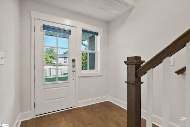 doorway featuring dark wood-type flooring