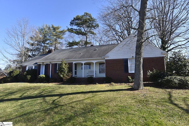 ranch-style home with a front lawn