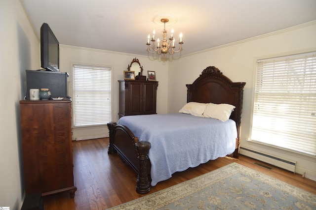 bedroom with multiple windows, dark hardwood / wood-style flooring, a notable chandelier, and baseboard heating