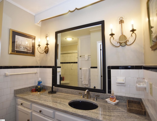 bathroom featuring tile walls, vanity, crown molding, and a shower with curtain