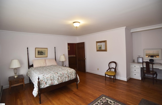 bedroom with ornamental molding and dark hardwood / wood-style floors