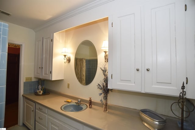 bathroom featuring vanity and ornamental molding