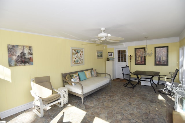 living room with crown molding and ceiling fan