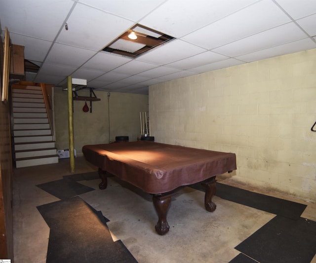 recreation room with a drop ceiling, pool table, and concrete floors