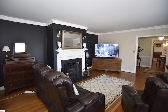 living room featuring wood-type flooring and crown molding