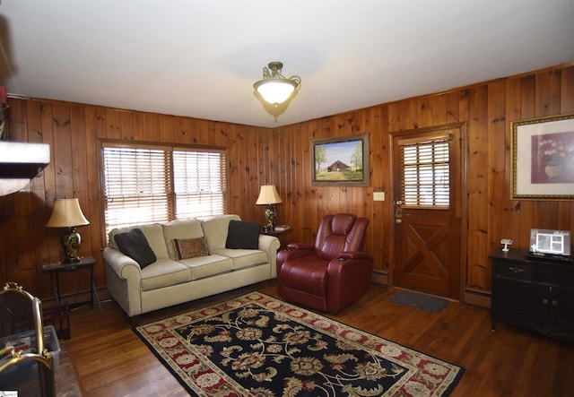 living room featuring dark hardwood / wood-style flooring, a wealth of natural light, and baseboard heating