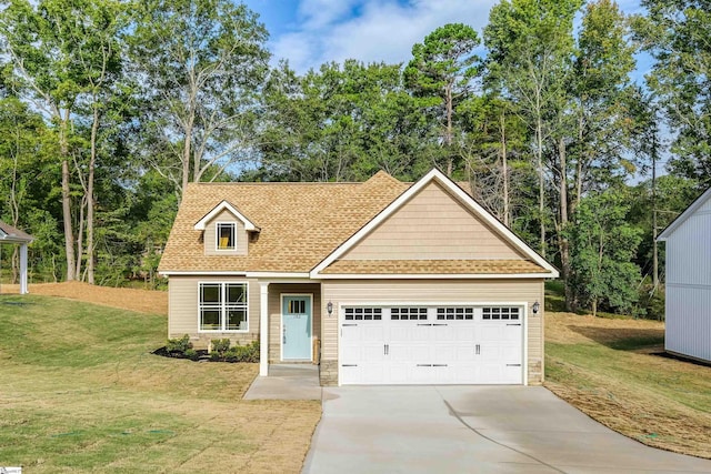 view of front of house with a front yard and a garage