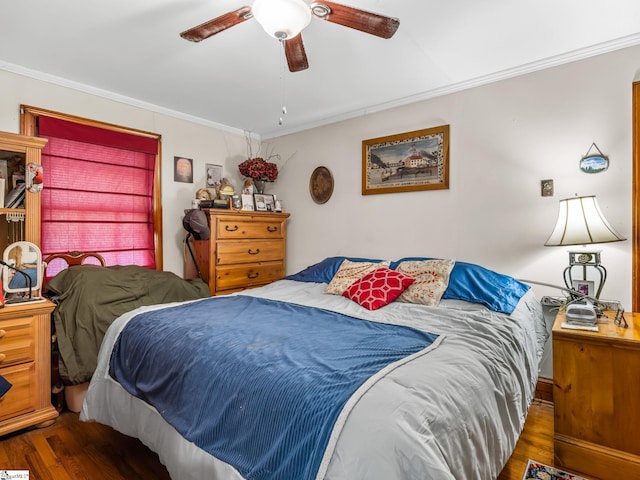 bedroom featuring ceiling fan, dark wood-type flooring, and ornamental molding