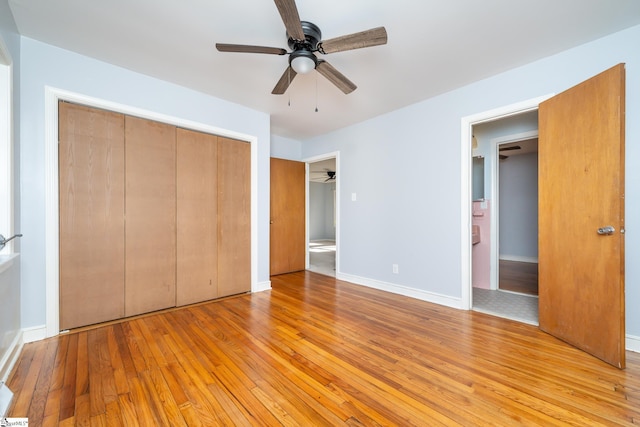 unfurnished bedroom featuring ceiling fan, light wood-type flooring, and a closet