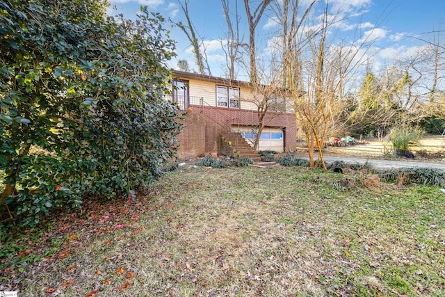 view of yard featuring a garage