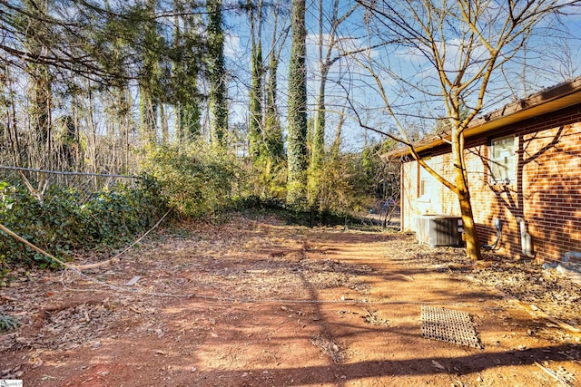 view of yard featuring central AC unit