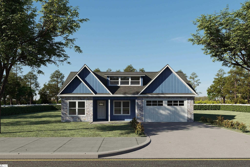 craftsman house with a front yard and a garage