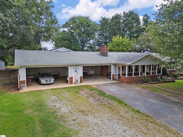 single story home featuring a garage, a front lawn, and covered porch