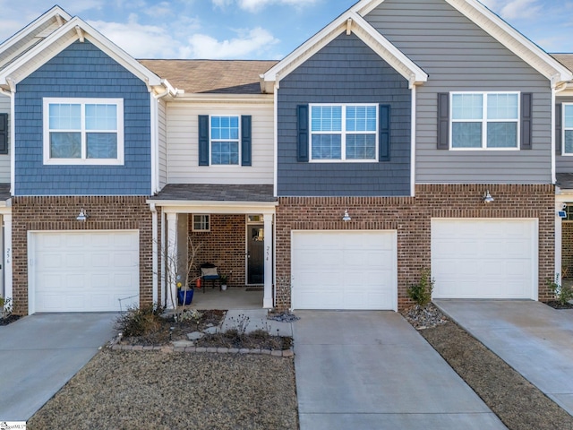 townhome / multi-family property featuring a garage