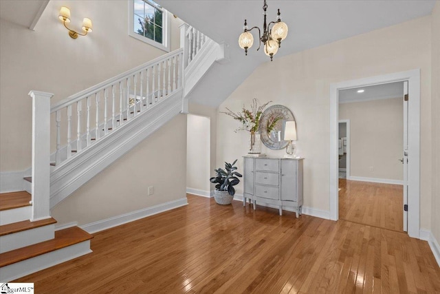 interior space featuring wood-type flooring and a chandelier