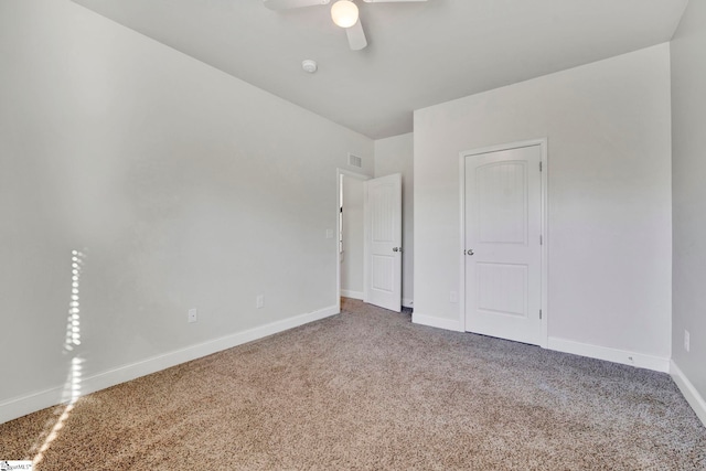 unfurnished bedroom with carpet flooring and ceiling fan